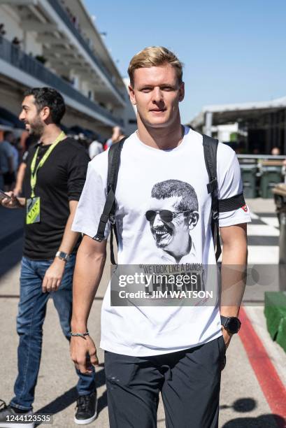 Haas F1 Team's German driver Mick Schumacher arrives in the paddock for the Formula One United States Grand Prix practice session, at the Circuit of...