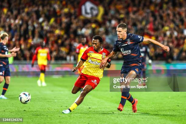 Lois OPENDA of Lens and Maxime ESTEVE of Montpellier during the Ligue 1 Uber Eats match between Lens and Montpellier at Stade Felix Bollaert on...