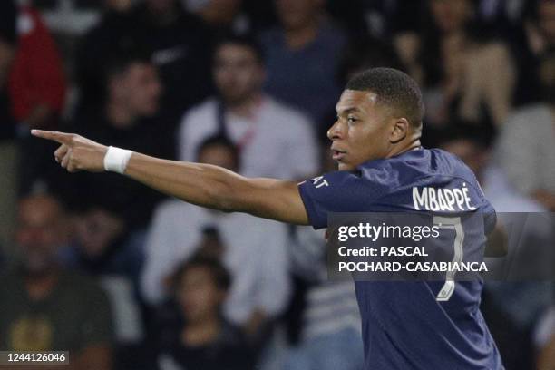 Paris Saint-Germain's French forward Kylian Mbappe celebrates after scoring a goal during the French L1 football match between AC Ajaccio and Paris...
