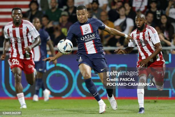 Paris Saint-Germain's French forward Kylian Mbappe runs with the ball during the French L1 football match between AC Ajaccio and Paris Saint-Germain...