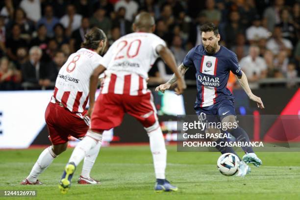 Paris Saint-Germain's Argentine forward Lionel Messi runs with the ball during the French L1 football match between AC Ajaccio and Paris...