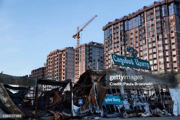 Destroyed shopping center remains untouched as the war torn city comes back to life after many residents returned and shops reopened on October 21,...