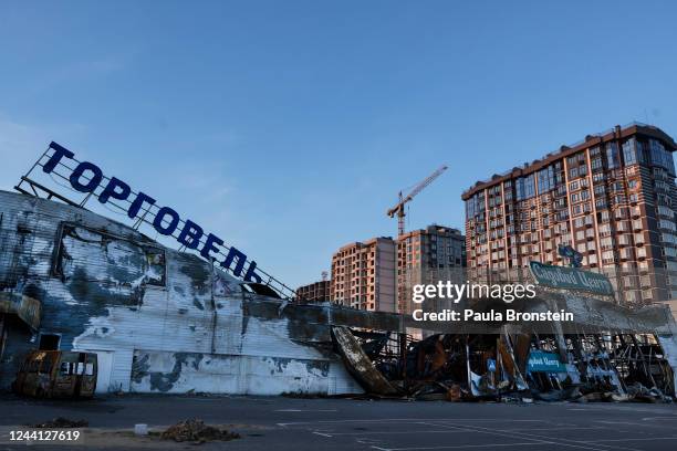 Destroyed shopping center remains untouched as the war torn city comes back to life after many residents returned and shops reopened on October 21,...
