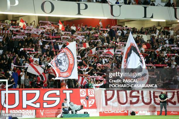 Ajaccio's supporters cheer their team during the French L1 football match between AC Ajaccio and Paris Saint-Germain at the Francois Coty Stadium in...