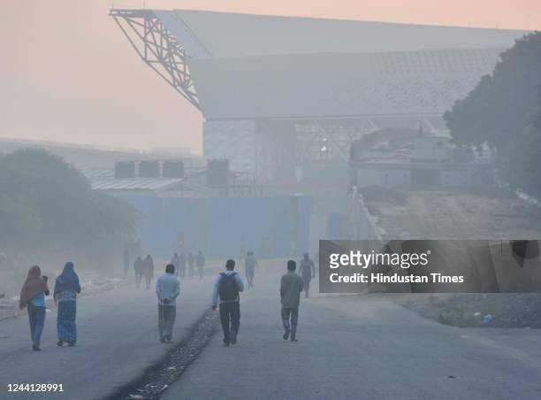 Commuters out in early morning fog, at Dwarka, on October 21, 2022 in New Delhi, India. Every year, smog and pollution has been a major concern for...