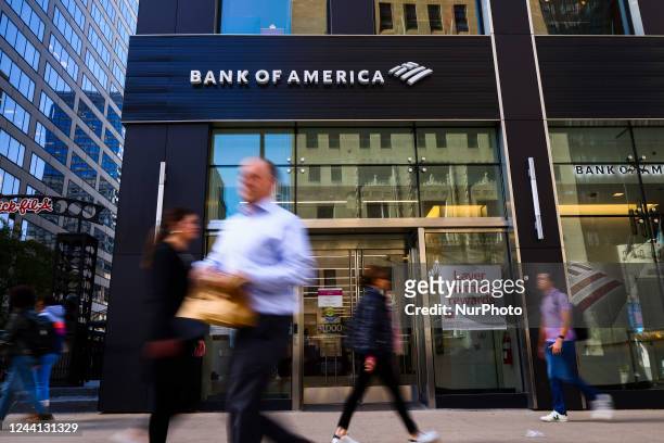 People walk by Bank of America in Chicago, United States, on October 14, 2022.