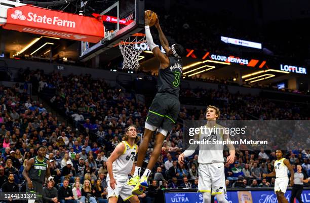 Jaden McDaniels of the Minnesota Timberwolves dunks the ball in the first quarter of the game against the Utah Jazz at Target Center on October 21,...