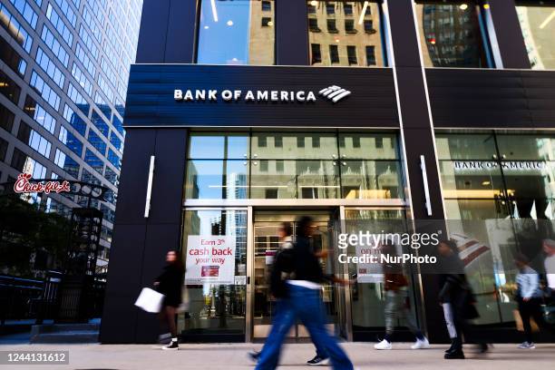 People walk by Bank of America in Chicago, United States, on October 14, 2022.