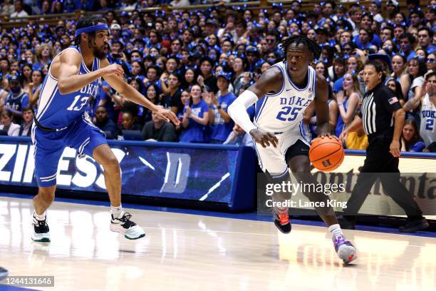 Mark Mitchell moves the ball against Jacob Grandison of the Duke Blue Devils during Countdown to Craziness at Cameron Indoor Stadium on October 21,...