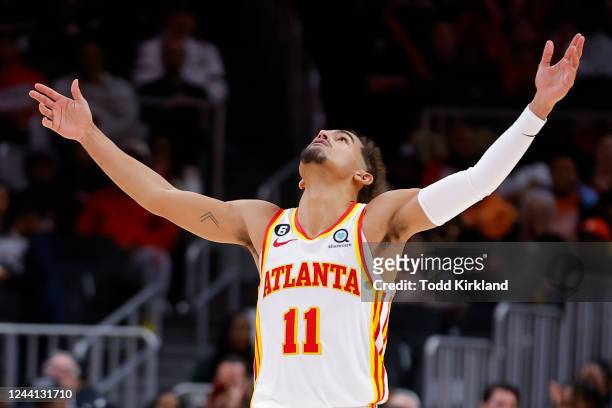 Trae Young of the Atlanta Hawks reacts during the second half against the Orlando Magic at State Farm Arena on October 21, 2022 in Atlanta, Georgia....