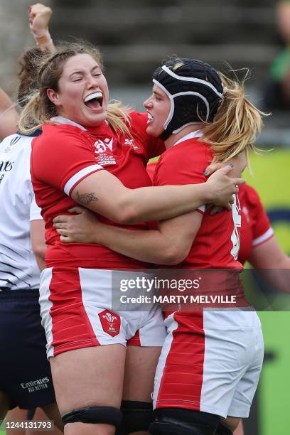 Wales' Gwen Crabb celebrates a try with teammate Bethan Lewis during the New Zealand 2021 Women's Rugby World Cup Pool match between Australia and...