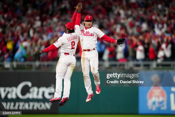 Jean Segura and Bryson Stott of the Philadelphia Phillies celebrate after winning Game 3 of the NLCS between the San Diego Padres and the...