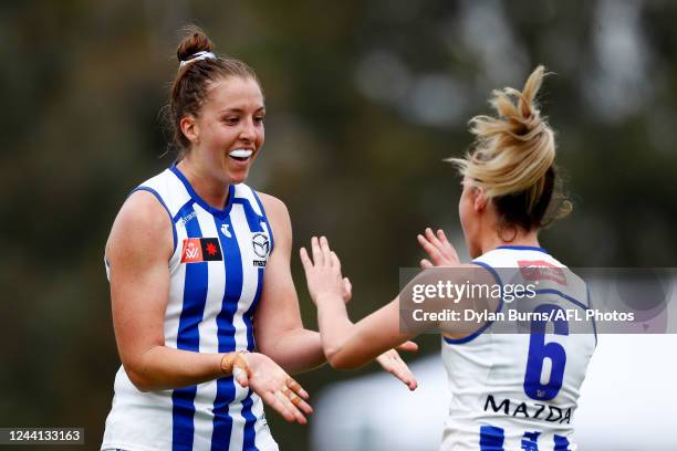 Emma King of the Kangaroos celebrates a goal with Alice O'Loughlin of the Kangaroos during the 2022 S7 AFLW Round 09 match between the Collingwood...