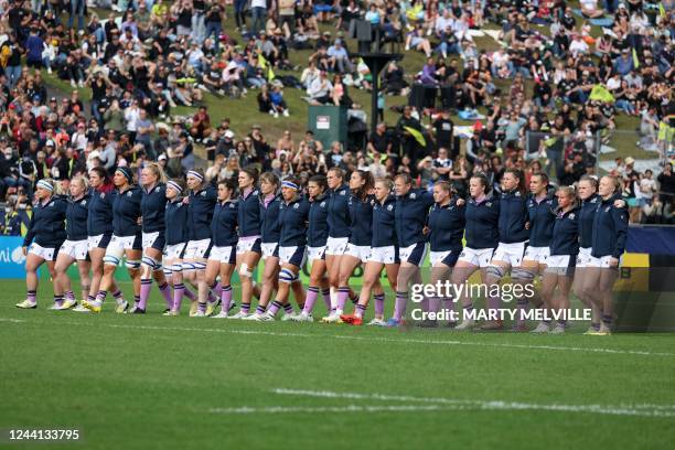 Scotland's players advance as New Zealand's players perform the Haka during the New Zealand 2021 Womens Rugby World Cup Pool match between New...