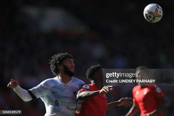 Liverpool's English defender Joe Gomez marks Nottingham Forest's Nigerian striker Taiwo Awoniyi during the English Premier League football match...