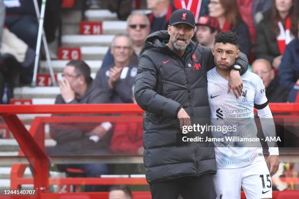 Jurgen Klopp the manager/head coach of Liverpool and Alex Oxlade-Chamberlain of Liverpool during the Premier League match between Nottingham Forest...