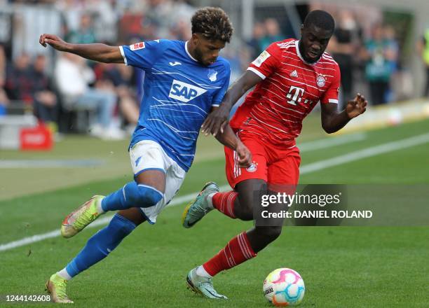 Hoffenheim's French forward Georginio Rutter and Bayern Munich's French defender Dayot Upamecano vie for the ball during the German first division...