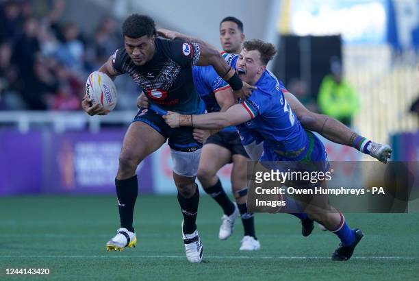 Fiji's Taniela Sadrugu is tackled by Italy's Jack Colovatti during the Rugby League World Cup group B match at Kingston Park, Newcastle upon Tyne....