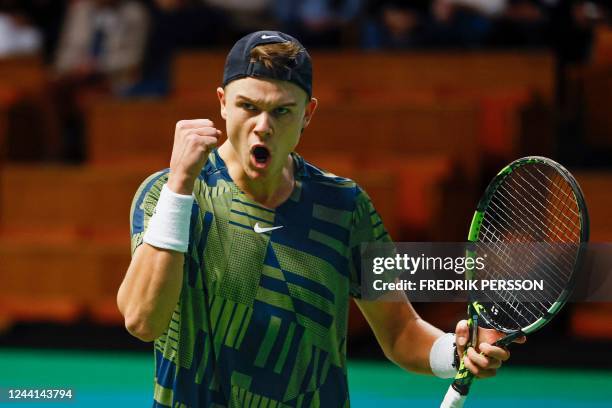 Denmark's Holger Rune celebrates winning a point against Australia's Alex de Minaur during the men's singles semi-final match of the ATP Stockholm...