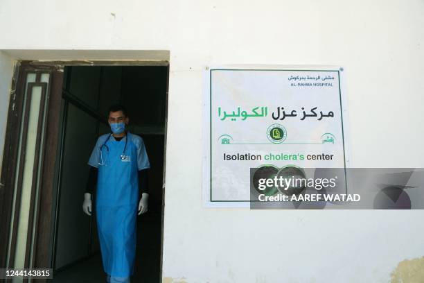 Medic walks at a recently-opened medical center for Cholera cases in the Syrian town of Darkush, on the outskirts of the rebel-held northwestern...