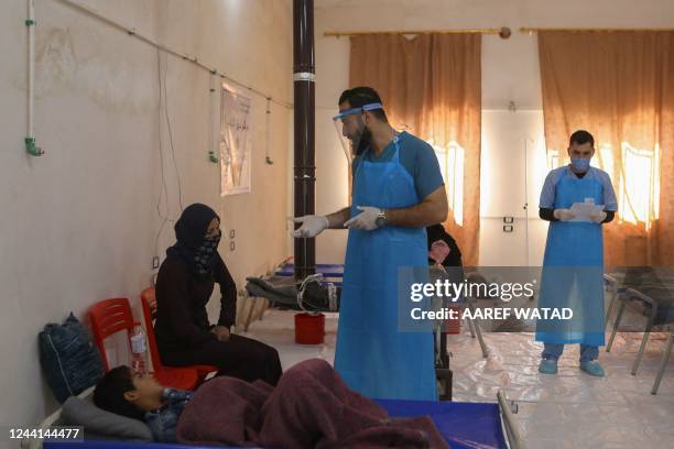 Patients receive treatment at a recently-opened medical center for Cholera cases in the Syrian town of Darkush, on the outskirts of the rebel-held...