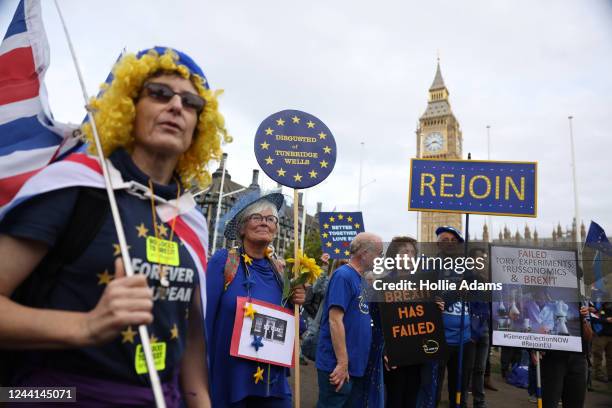 Demonstrators attend the National Rejoin March in Parliament Square on October 22, 2022 in London, United Kingdom. Protesters implore the government...