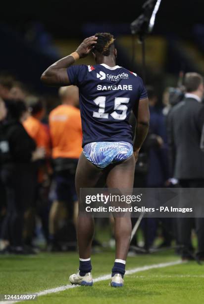 France's Justin Sangare leaves the field after giving his shorts away to a fan after the Rugby League World Cup group A match at the University of...