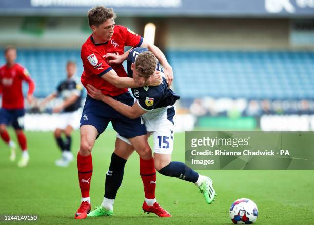 West Bromwich Albion's Adam Reach tussles with Millwall's Charlie Cresswell during the Sky Bet Championship match at The Den, London. Picture date:...