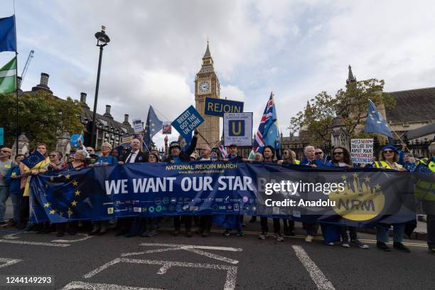 Pro-EU demonstrators arrive outside Houses of Parliament during a march calling for the UK to rejoin the European Union in London, United Kingdom on...