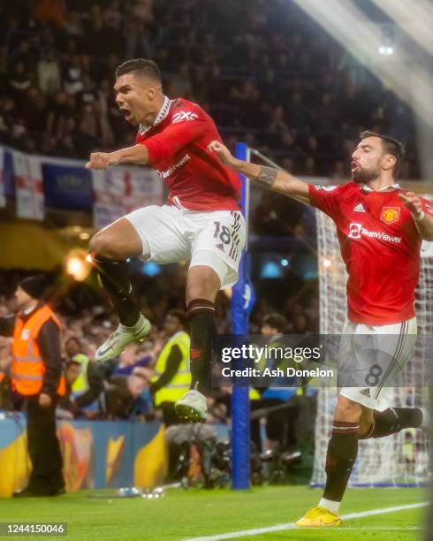 Casemiro of Manchester United celebrates scoring a goal to make the score 1-1 with Bruno Fernandes during the Premier League match between Chelsea FC...