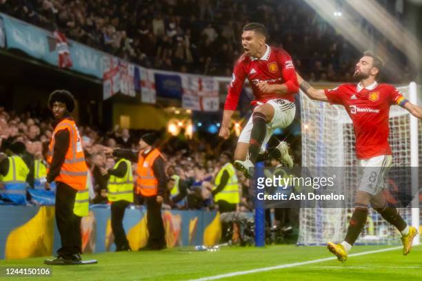 Casemiro of Manchester United celebrates scoring a goal to make the score 1-1 with Bruno Fernandes during the Premier League match between Chelsea FC...