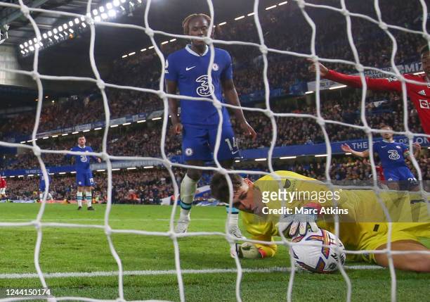 Kepa Arrizabalaga of Chelsea is unable to stop the equalising goal from Casemiro of Manchester United during the Premier League match between Chelsea...
