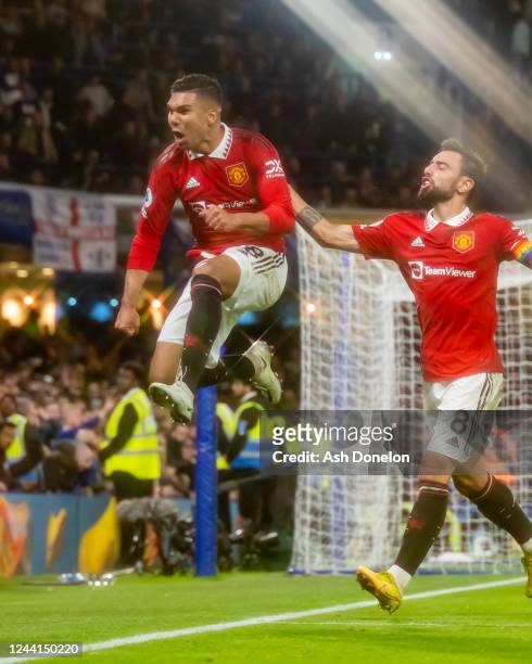 Casemiro of Manchester United celebrates scoring a goal to make the score 1-1 with Bruno Fernandes during the Premier League match between Chelsea FC...