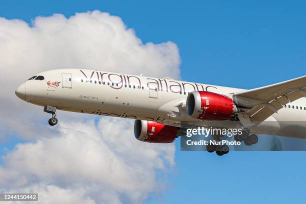 Virgin Atlantic Airways Boeing 787 Dreamliner as seen on final approach flying over the houses of Myrtle Avenue in London, a famous location for...