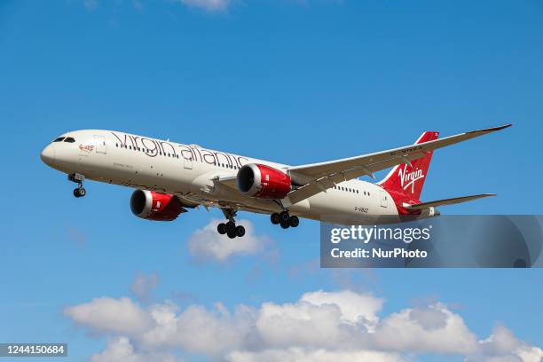 Virgin Atlantic Airways Boeing 787 Dreamliner as seen on final approach flying over the houses of Myrtle Avenue in London, a famous location for...