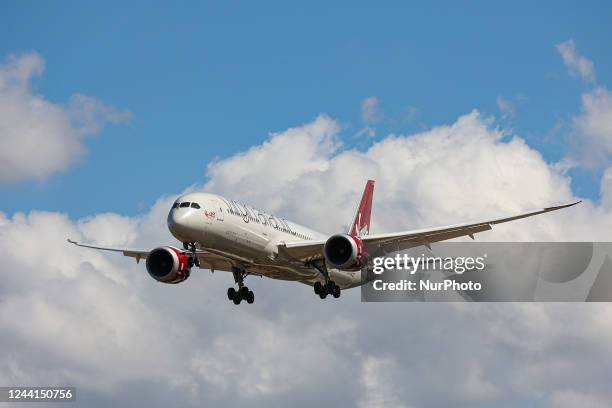 Virgin Atlantic Airways Boeing 787 Dreamliner as seen on final approach flying over the houses of Myrtle Avenue in London, a famous location for...