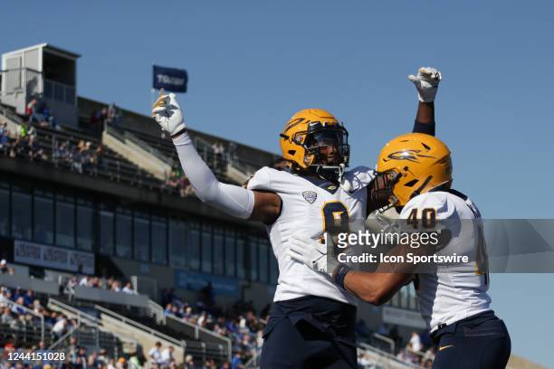 Toledo Rockets tight end Jamal Turner and Toledo Rockets tight end Lenny Kuhl celebrate a touchdown by Turner during the first quarter a college...