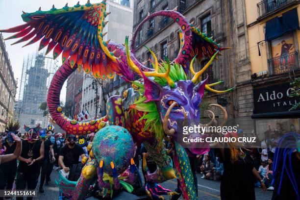 Picture of an "Alebrije" -a Mexican brightly coloured folk art sculpture representing a fantastical creature- taken during the Alebrijes Parade in...