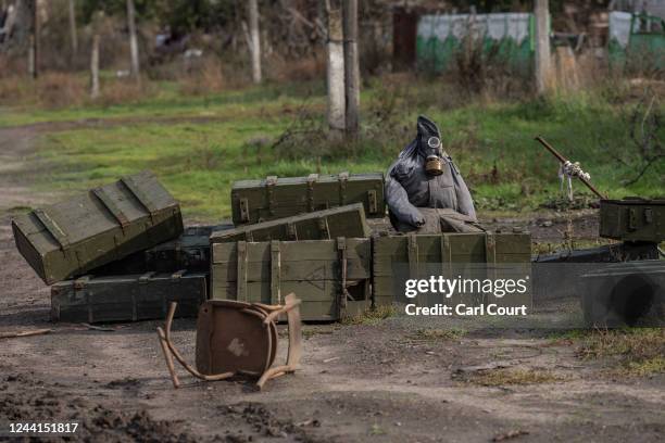 Dummy with a gas mask is placed by a barricade, on October 22, 2022 in Kam'yanka, Kharkiv oblast, Ukraine. Ukrainian president Volodymyr Zelensky has...