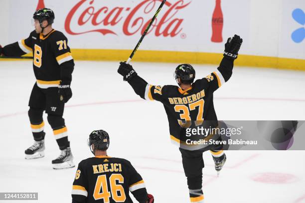 Patrice Bergeron of the Boston Bruins reacts to the overtime goal against the Minnesota Wild at the TD Garden on October 22, 2022 in Boston,...