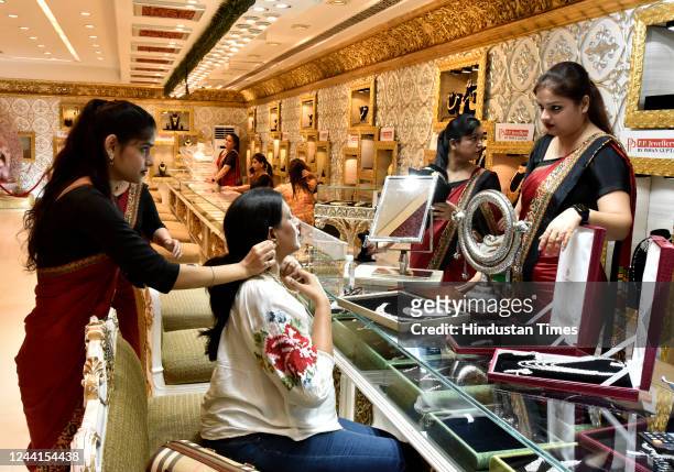 People purchase gold Jewellery at PP Jewellers Karol Bagh on Dhanteras, a Hindu festival associated with Lakshmi, the Goddess of wealth, on October...