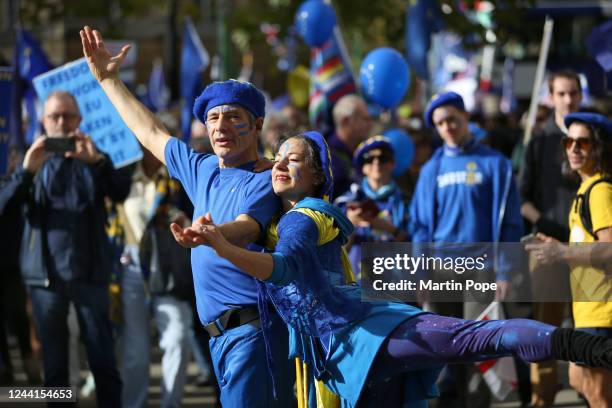 Supporters dance as the march progresses down Park Lane on October 22, 2022 in London, United Kingdom. Protesters implore the government to make EU...