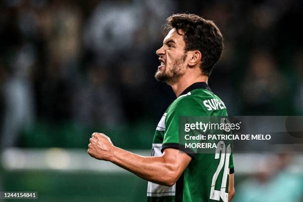 Sporting Lisbon's Portuguese midfielder Pedro Goncalves celebrates after scoring his team's third goal during the Portuguese league football match...