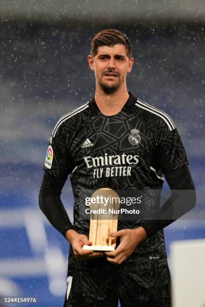 Thibaut Courtois goalkeeper of Real Madrid and Belgium shows his recently won trophy to his fans during the La Liga Santander match between Real...
