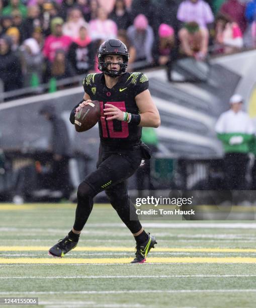 Quarterback Bo Nix of the Oregon Ducks runs to pass the ball against the UCLA Bruins during the first half at Autzen Stadium on October 22, 2022 in...