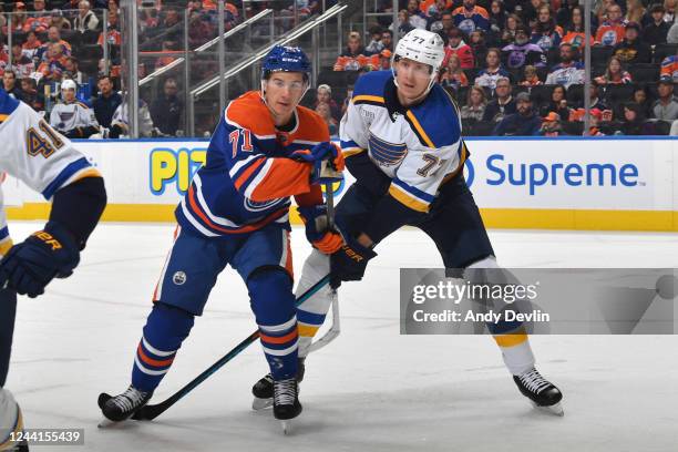 Ryan McLeod of the Edmonton Oilers battles for position against Niko Mikkola of the St. Louis Blues during the game on October 22, 2022 at Rogers...