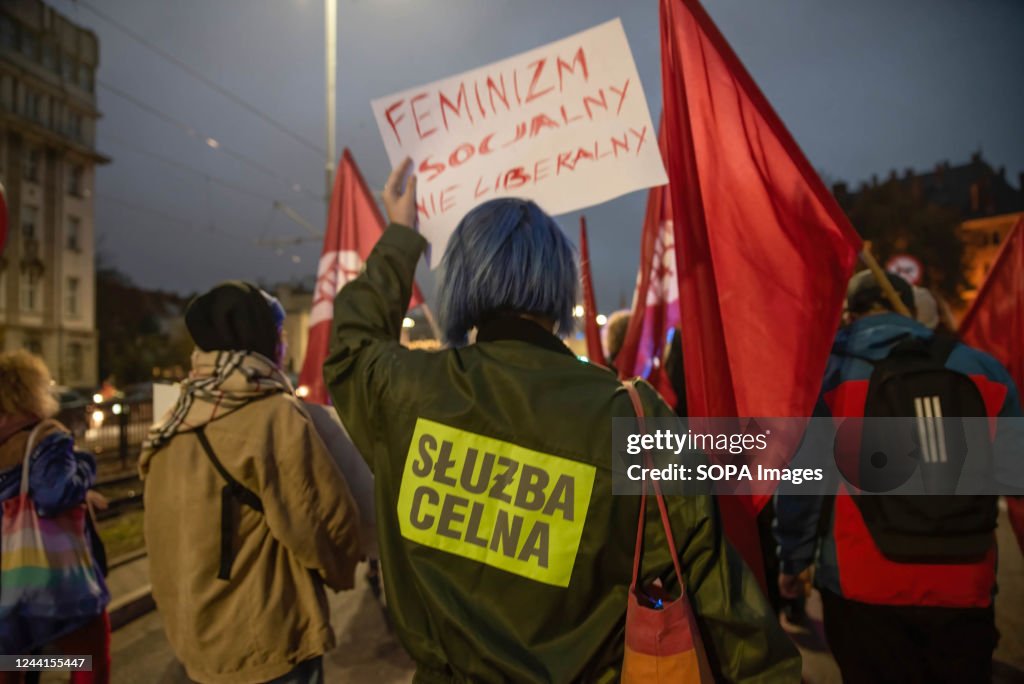Protestet A protester holds a placard during the demonstration. Exactly two ...