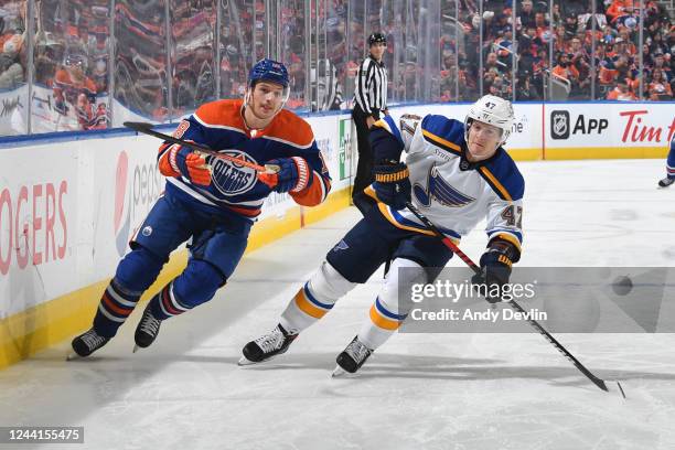 Zach Hyman of the Edmonton Oilers and Torey Krug of the St. Louis Blues skate down the ice during the game on October 22, 2022 at Rogers Place in...