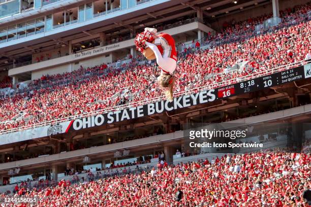 An Ohio State Buckeyes cheerleader performs during the third quarter of the college football game between the Iowa Hawkeyes and Ohio State Buckeyes...