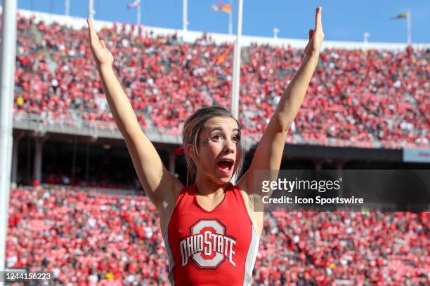 An Ohio State Buckeyes cheerleader celebrates an Ohio State touchdown during the college football game between the Iowa Hawkeyes and Ohio State...